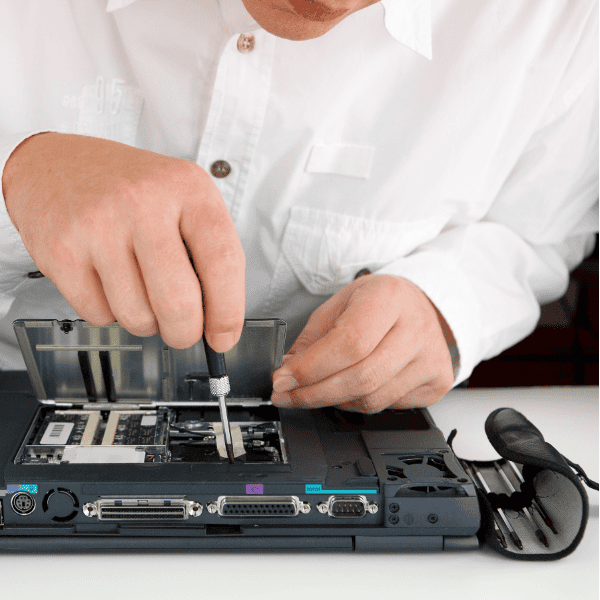 an EPOS Field Service engineer working on a computer